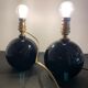 Pair of feet of black opaline art deco lamps