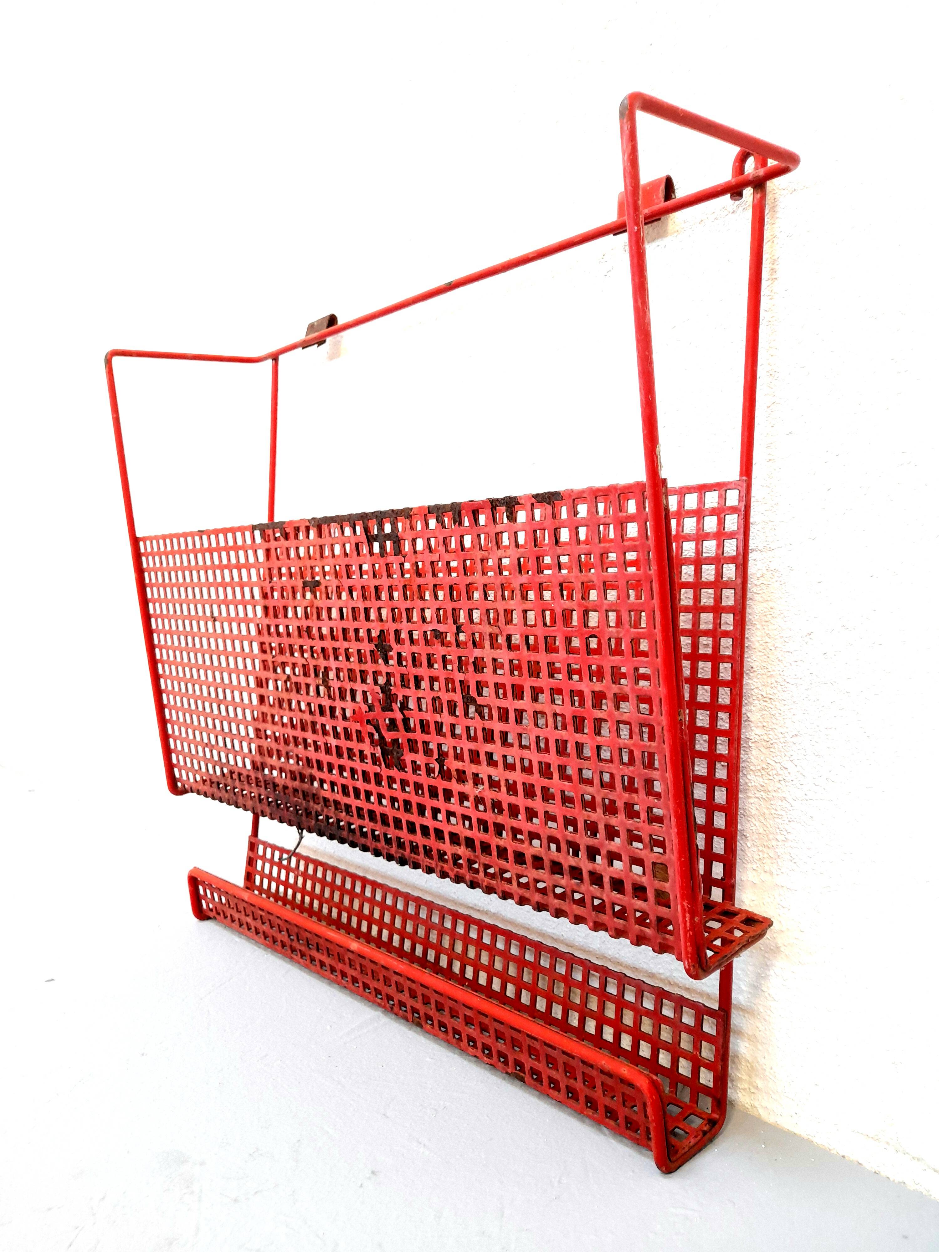 Vintage magazine rack in red lacquered perforated metal from the 70s