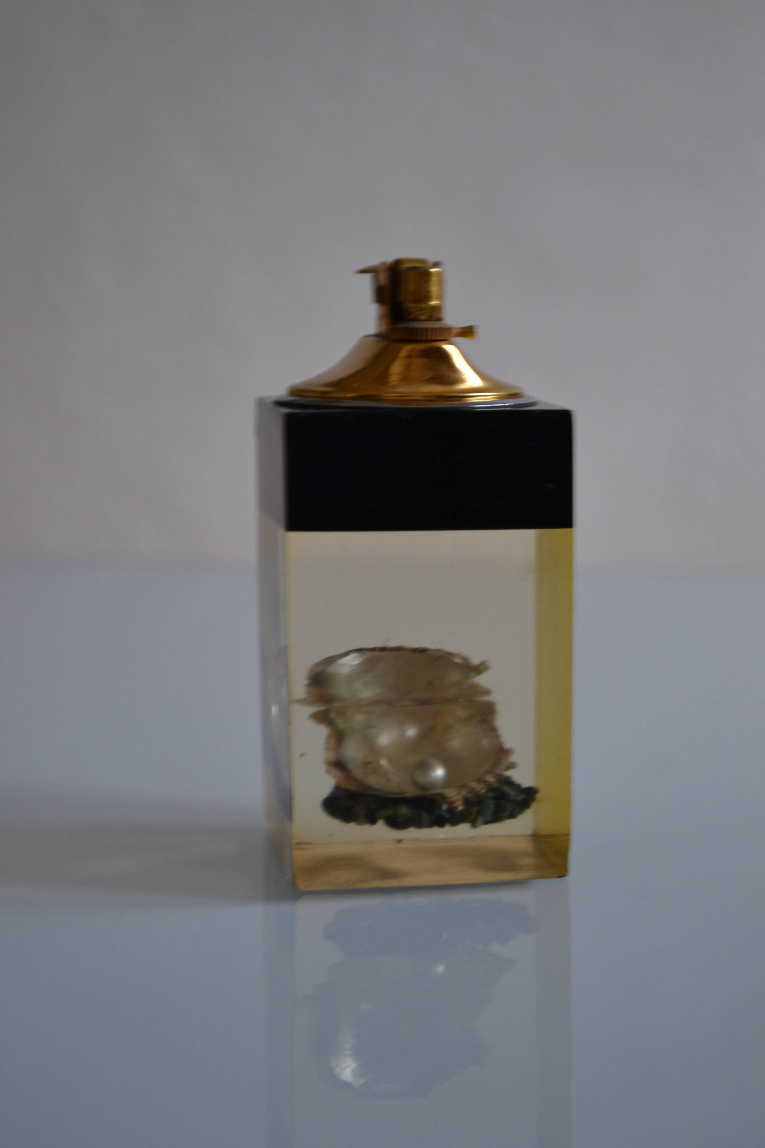 1970 Table lighter with pearl oyster in resin inclusion