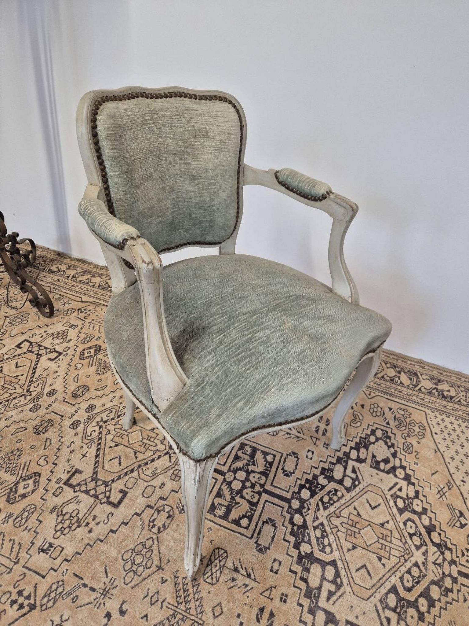 Louis XV style cabriolet armchair in patinated wood and velvet