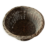 Round wicker basket with a patina