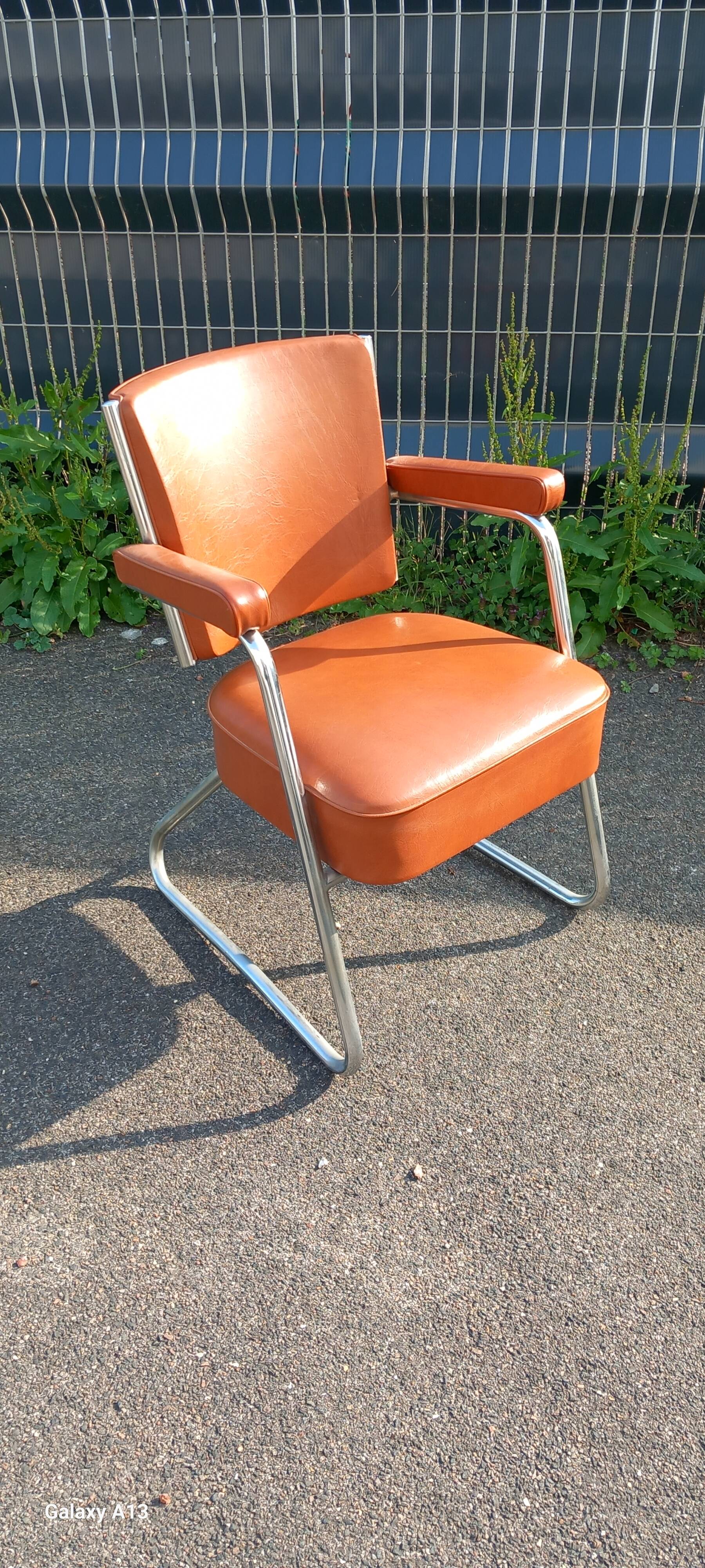 Vintage leatherette and chrome armchair