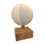 Handmade wooden ball lamp on a stand
