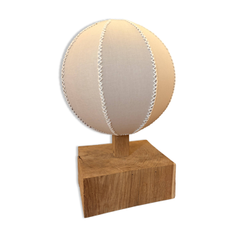 Handmade wooden ball lamp on a stand