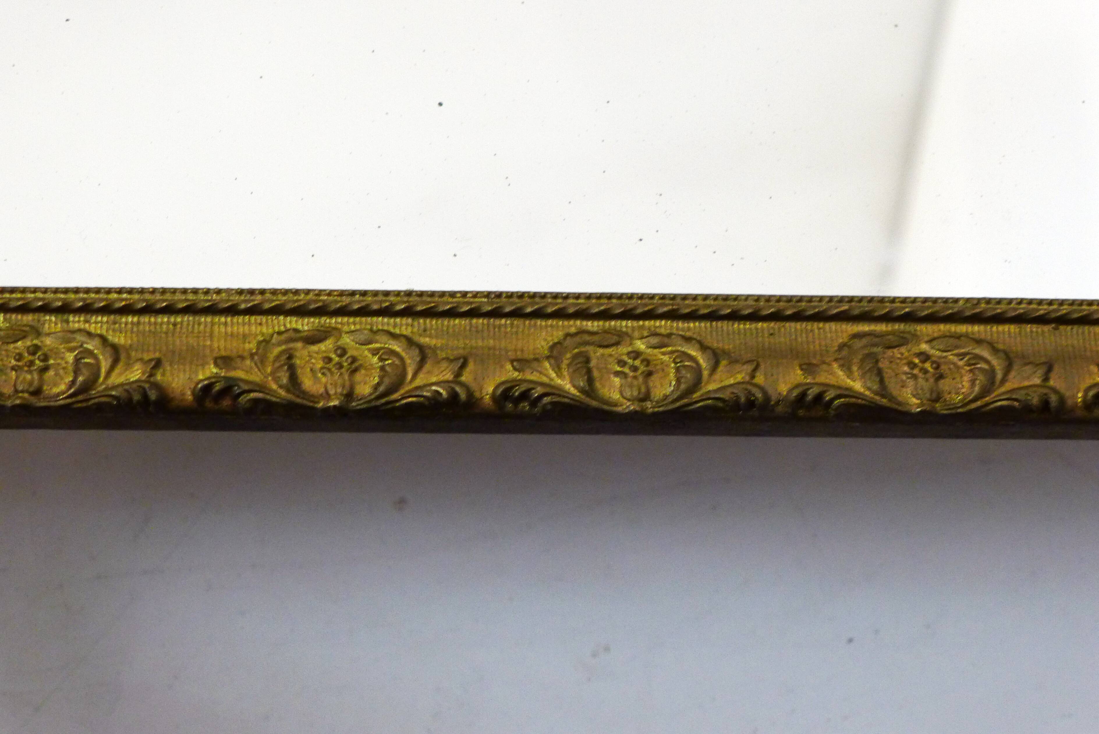 Large elongated gilded mirror