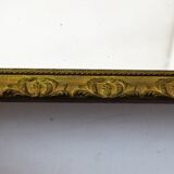Large elongated gilded mirror