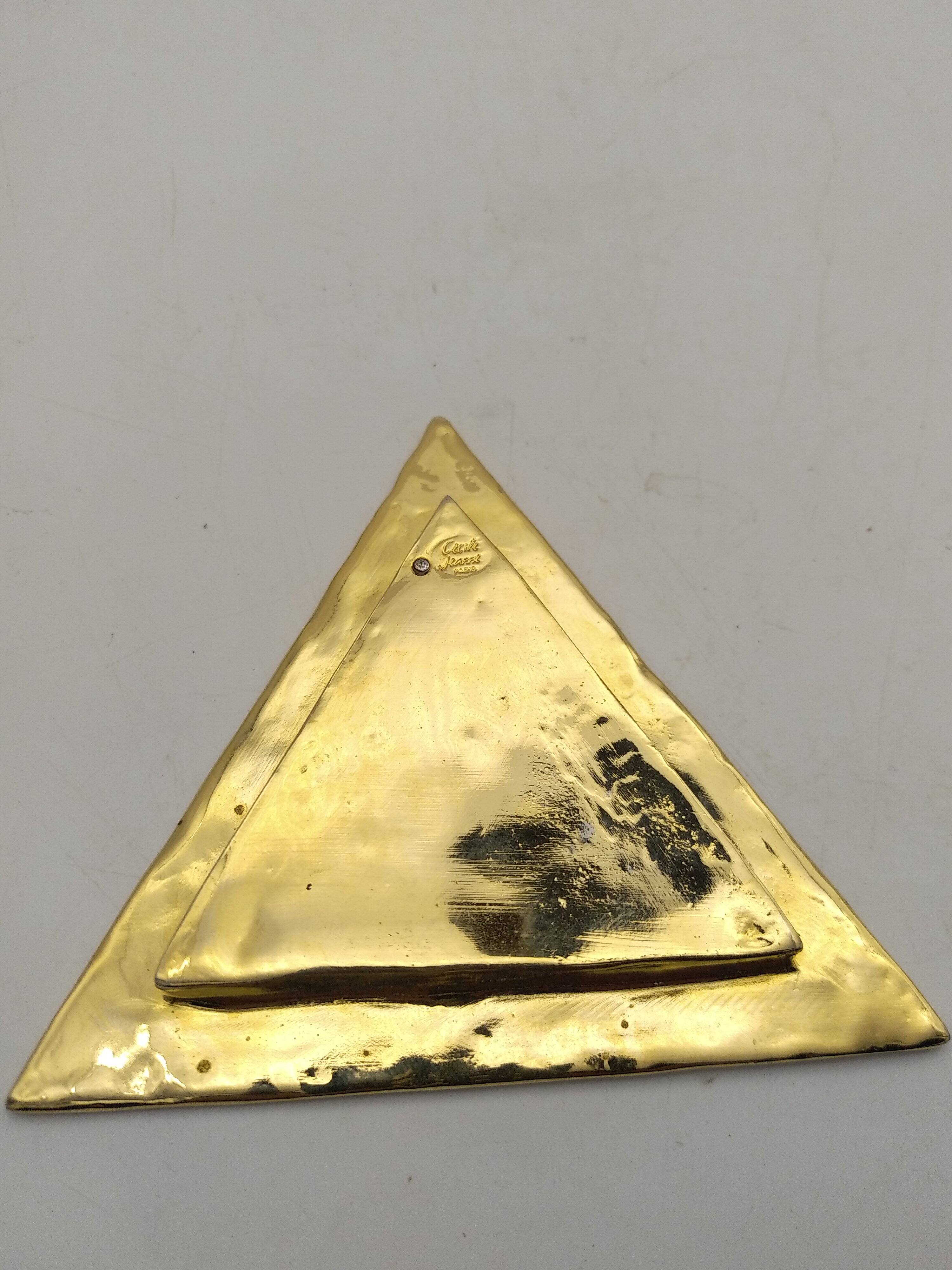 Cecile & jeanne: triangular gold-plated metal pocket tray with hieroglyph decoration.
