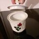 White porcelain coffee service of 3 pieces with a rose design.