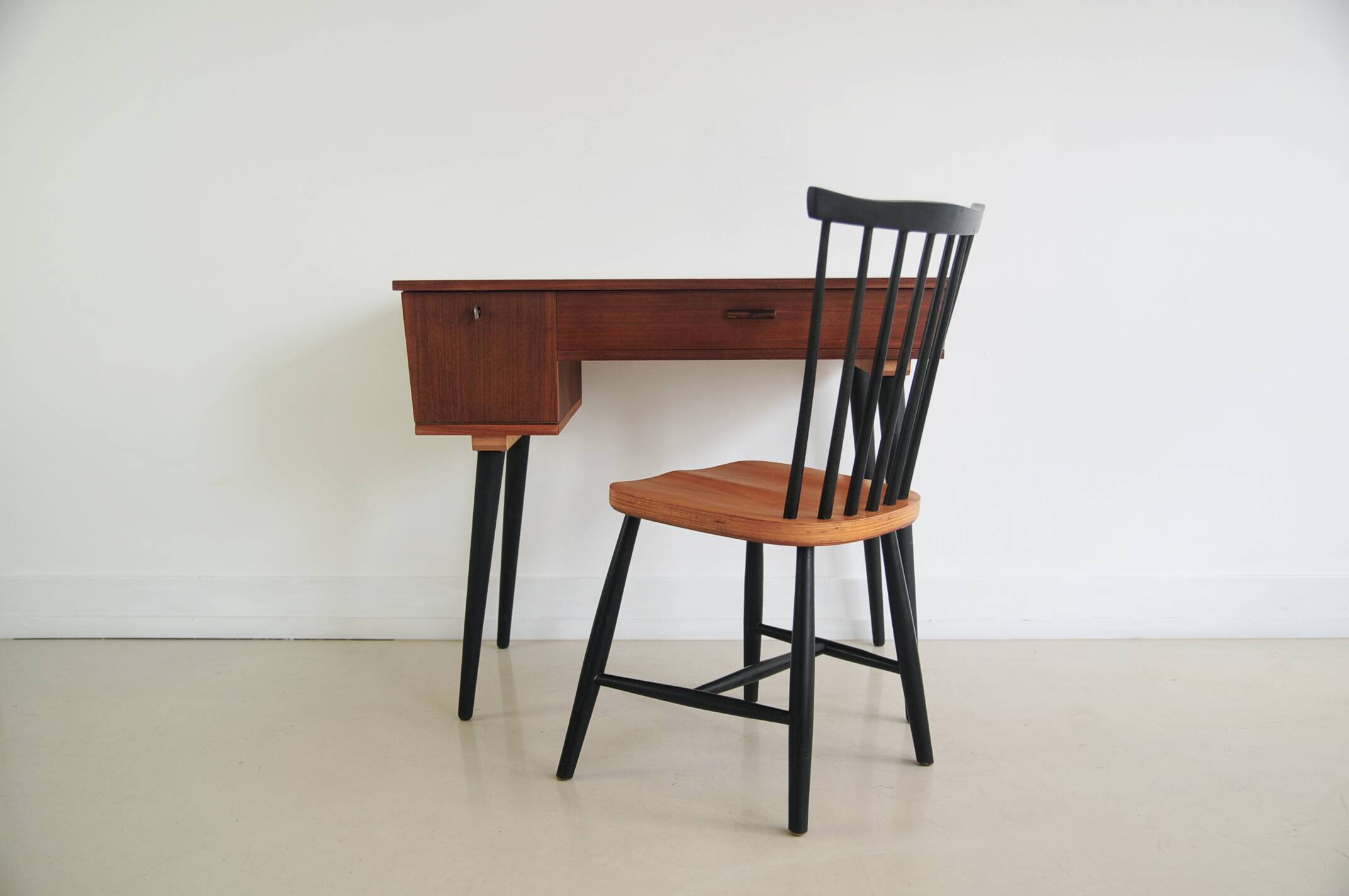 Vintage teak desk on black legs