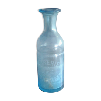 Blue bottle in engraved glass