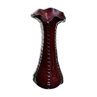 Burgundy red blown glass vase in the shape of a vintage corolla