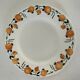 Set of 8 ironstone plates with coordinated designs.