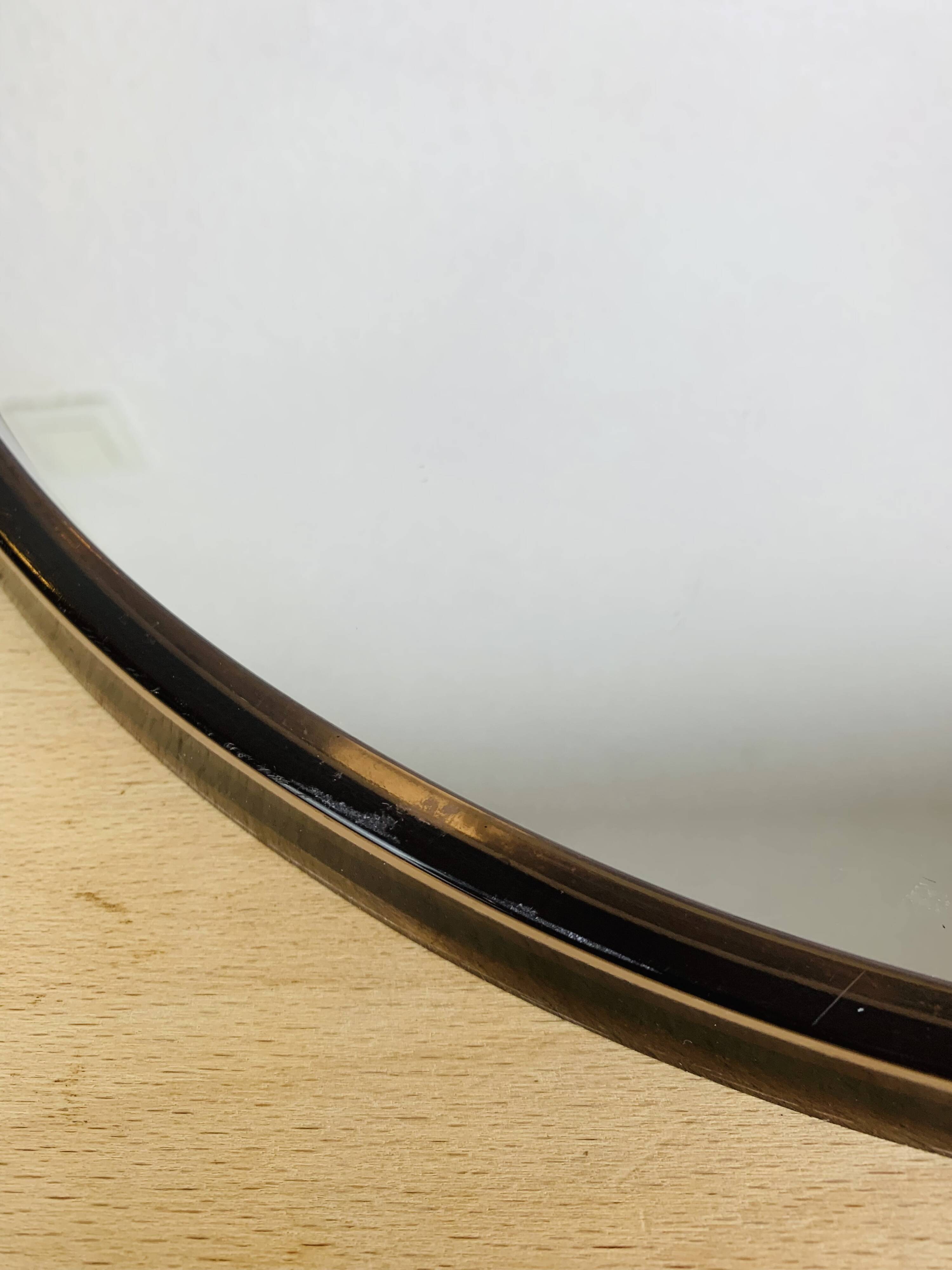 Miroir rond cerclage ambré années 70 vintage