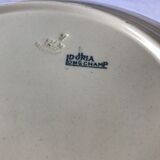 Round serving dish from the Longchamp earthenware factory, Doria model. Iron Land