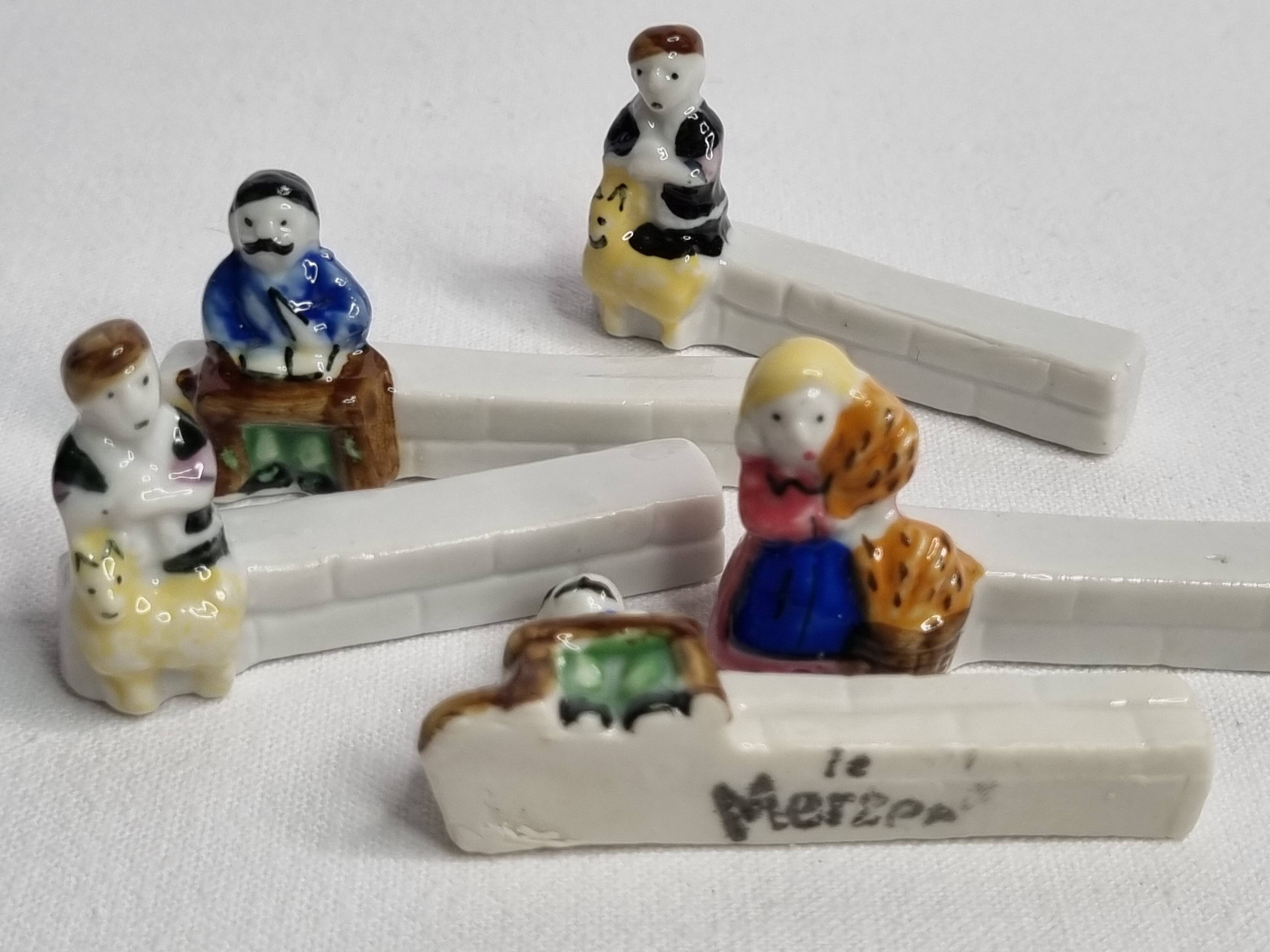 Five porcelain knife holders signed "Le Merzer", 6 cm