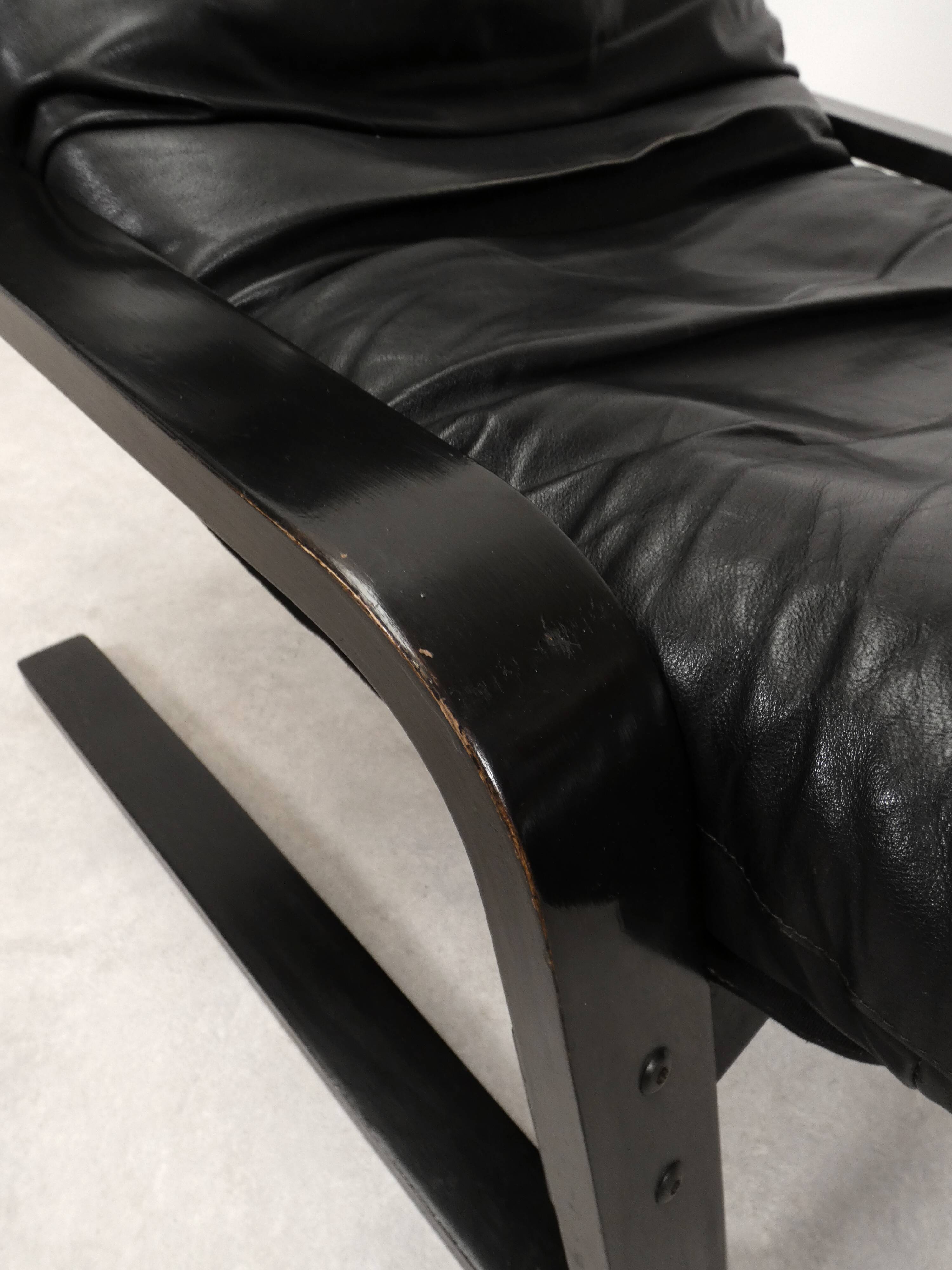 high-back scandianavian lounge chair in leather