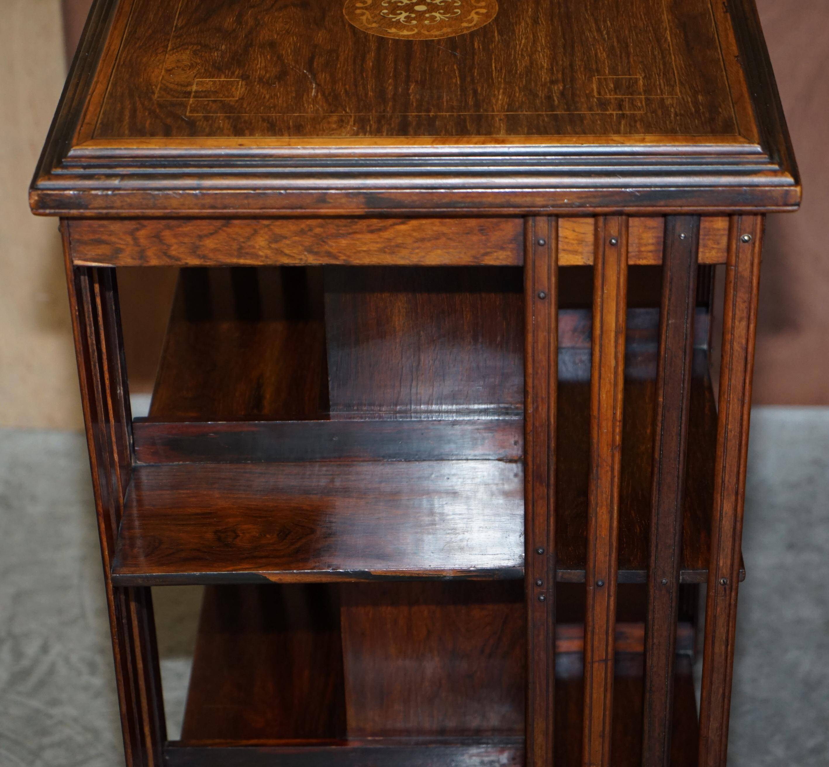 Edwardian revolving bookcase in hardwood with Sheraton inlay.