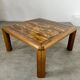 Old coffee table with golden marble top, 70s design, vintage wooden feet
