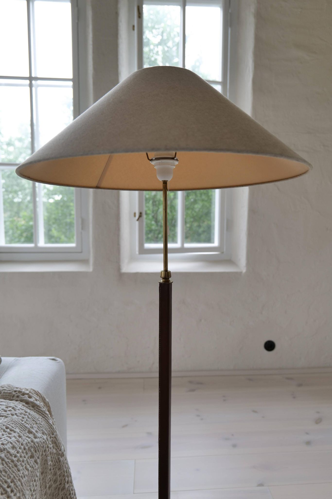 Mid-century brown leather and patinated brass floor lamp by Falkenbergs Belysning, Sweden, 1960s.