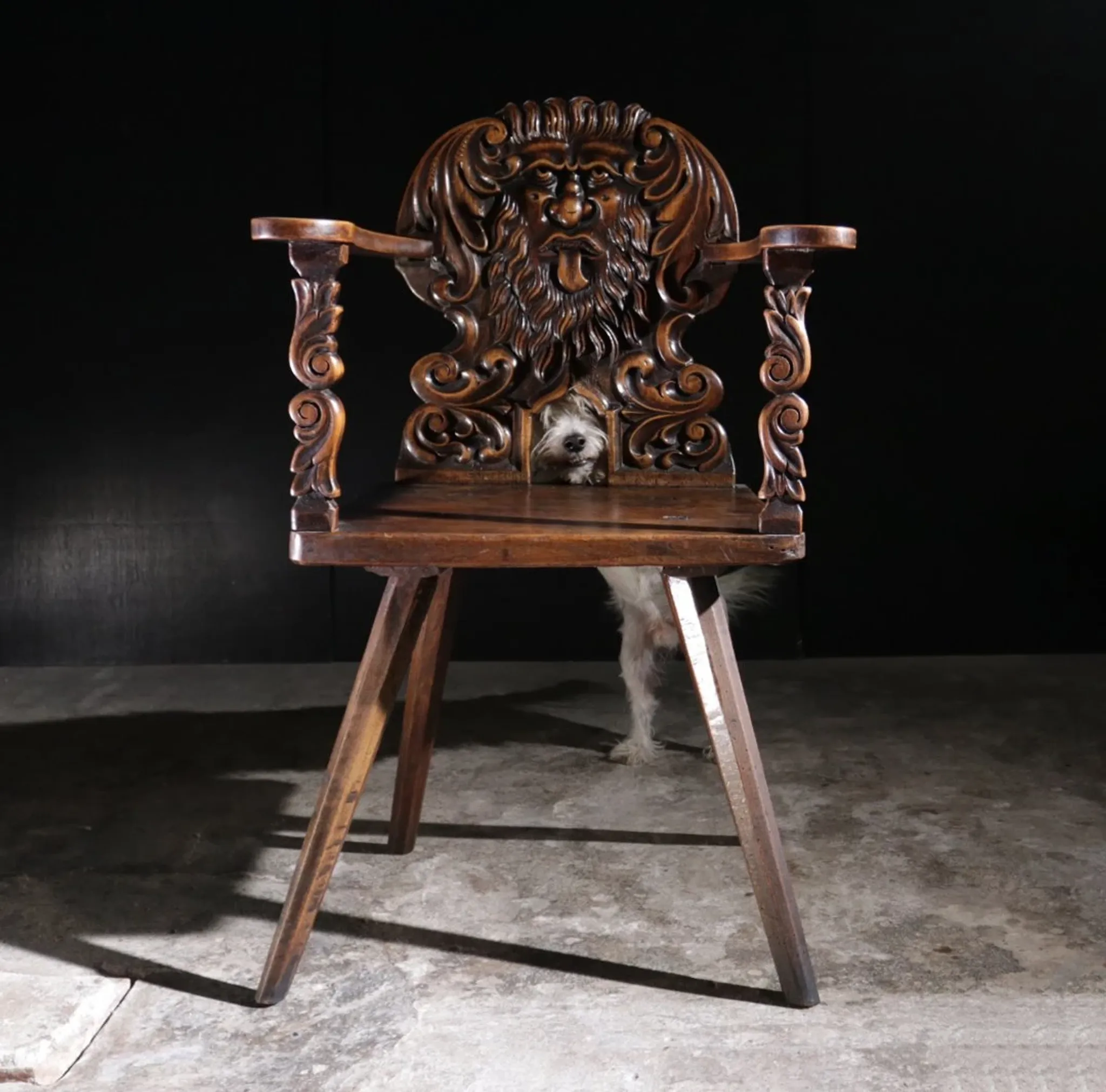 17th century Alpine carved walnut Brettstuhl armchair with grotesque mask