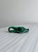 Antique green enamelled ceramic candle holder