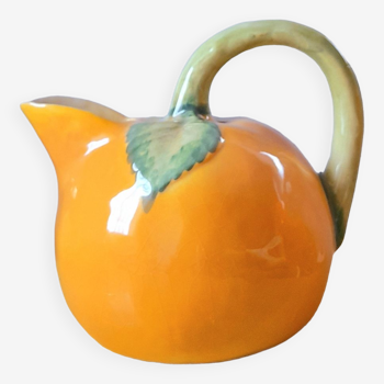 Orange pitcher in slip