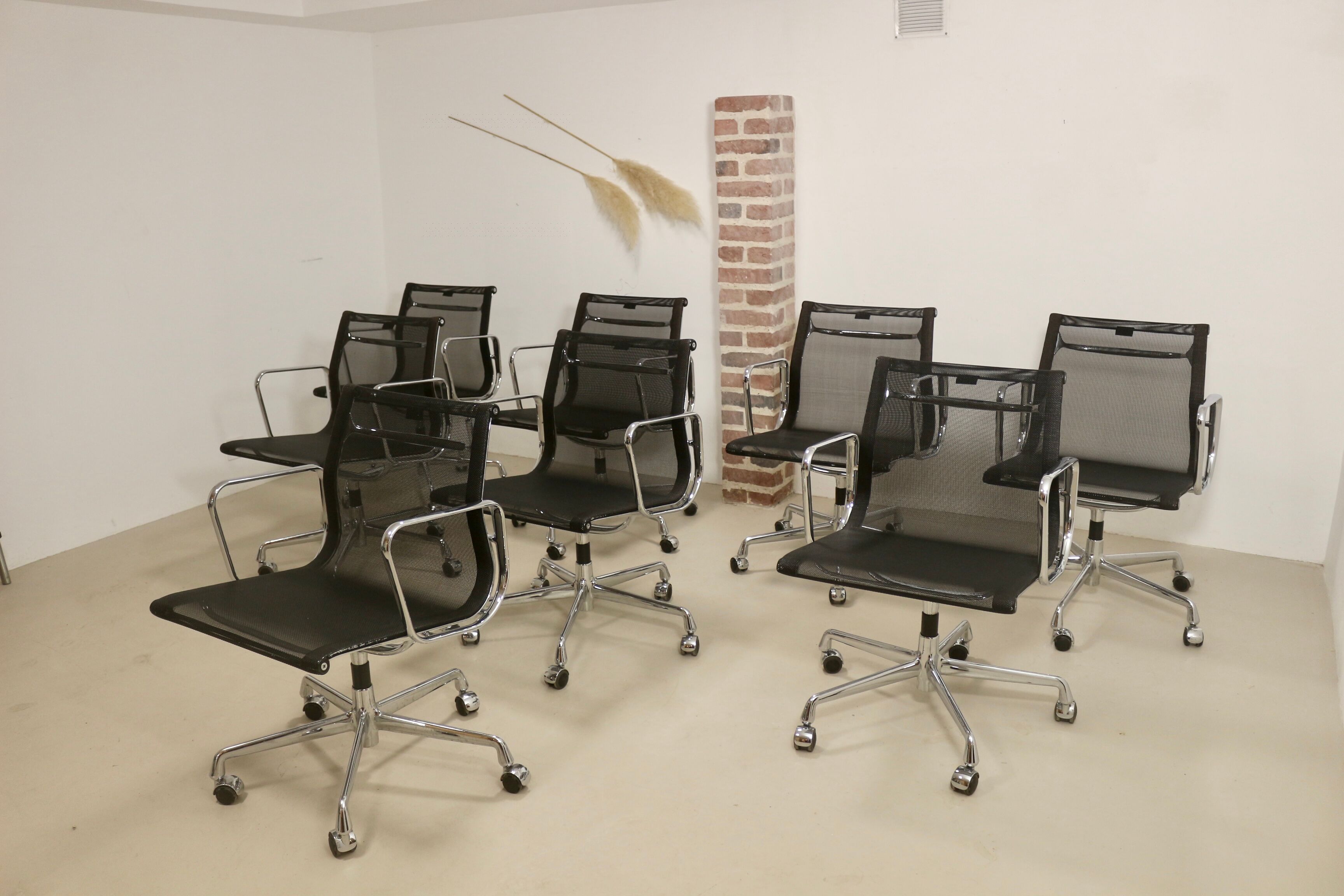 Set of 8 Charles and Ray Eames armchairs by Vitra model EA 117