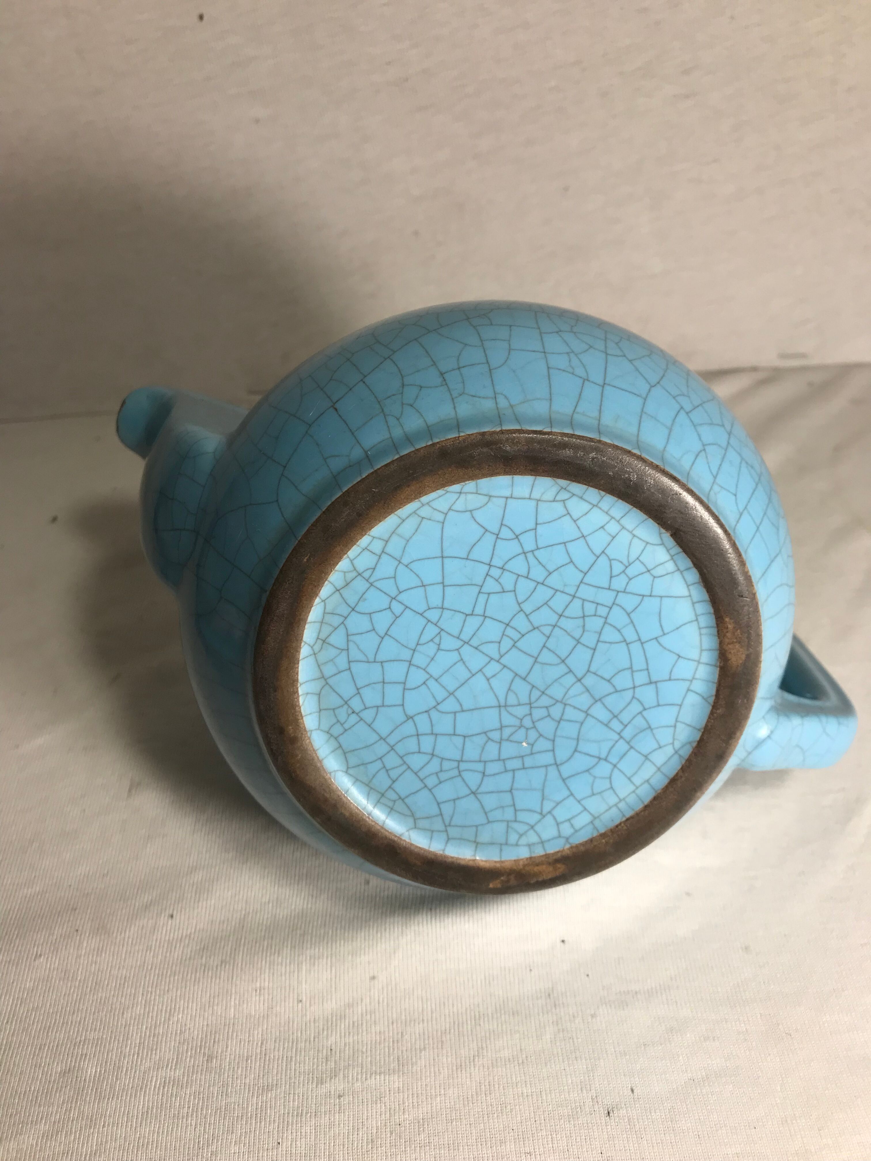 Cracked blue ceramic vintage teapot