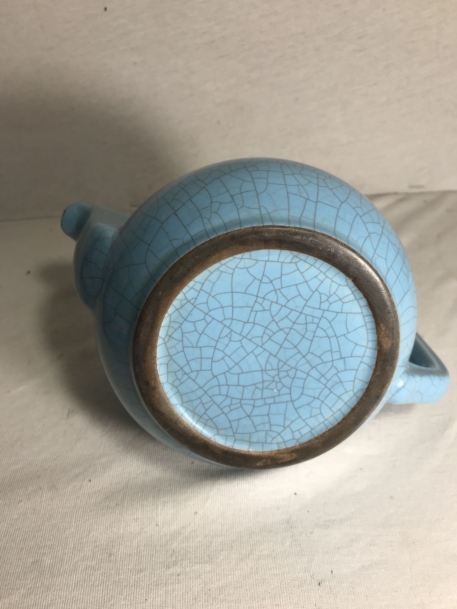 Cracked blue ceramic vintage teapot