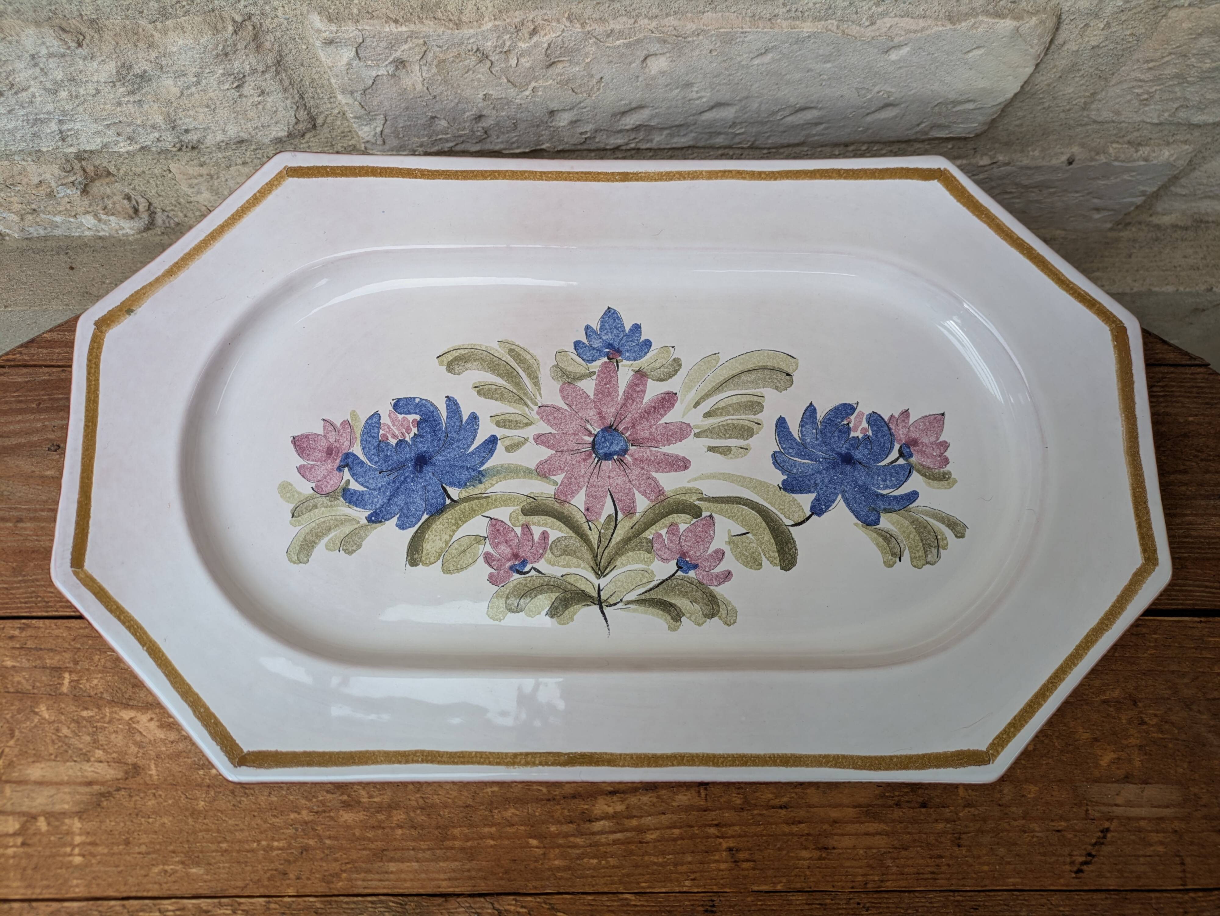 Rectangular earthenware dish with a glazed finish, decorated with a bouquet of flowers.