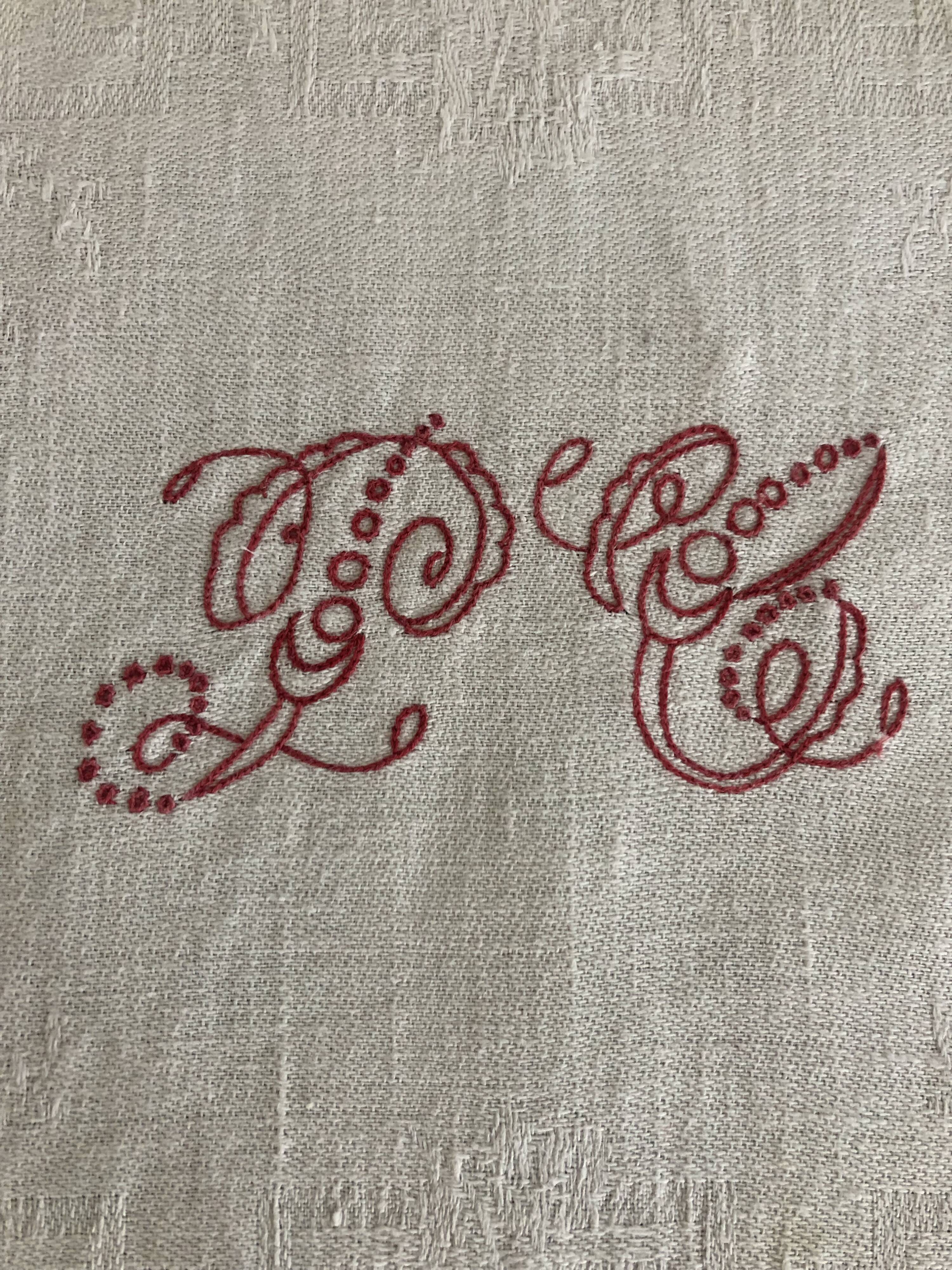 Ancient damask tablecloth with monogram