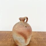 Small antique stoneware jar with handle