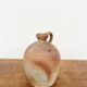 Small antique stoneware jar with handle