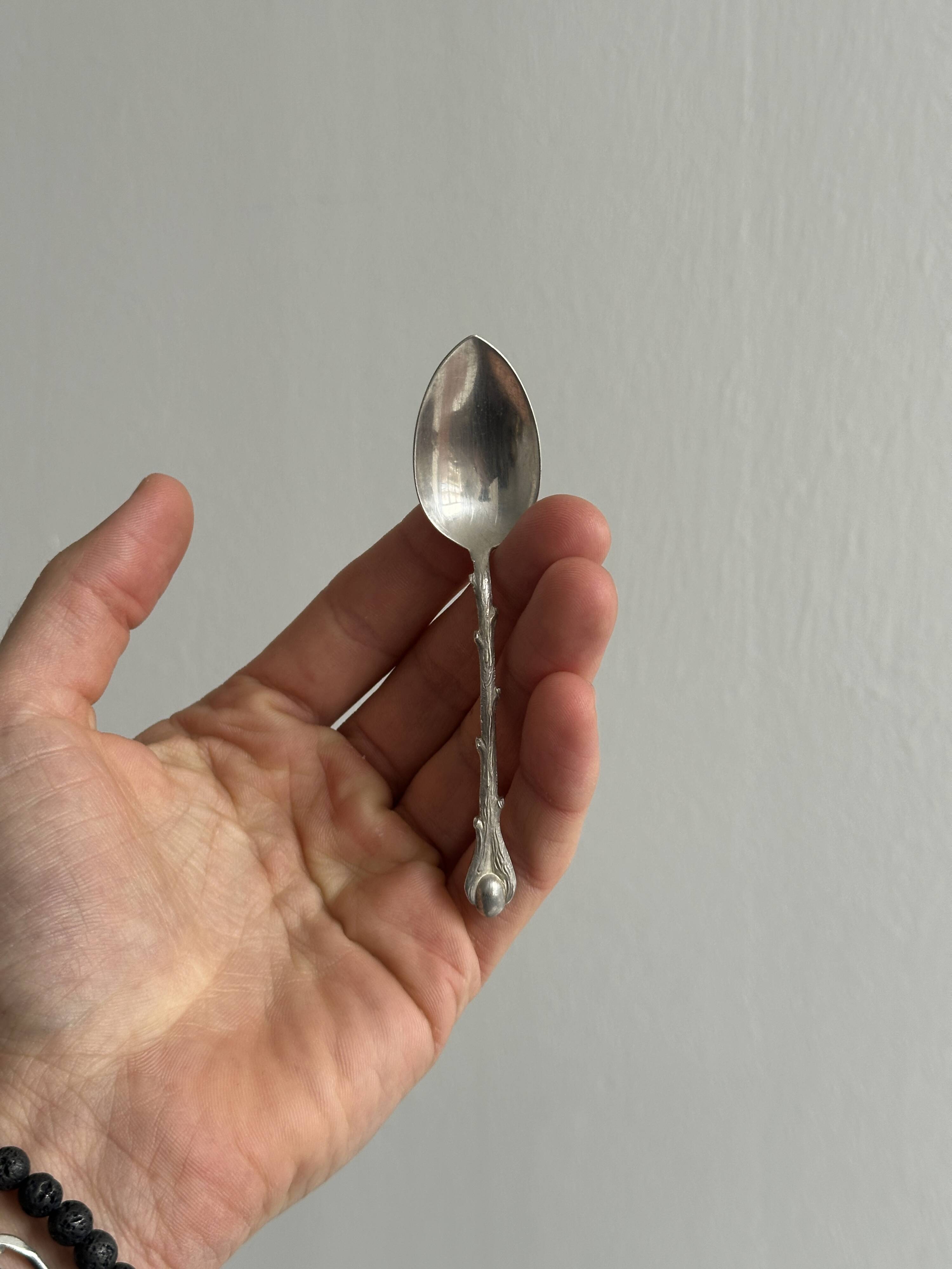 Set of 10 small silver metal spoons