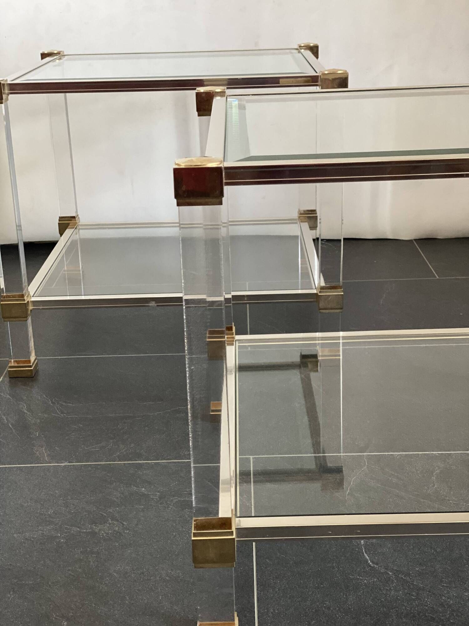 Pair of vintage and brass glass hollywood regency side tables by peter vandel
