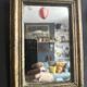 Miniature mirror from the 18th century in gilded wood, mercury glass.