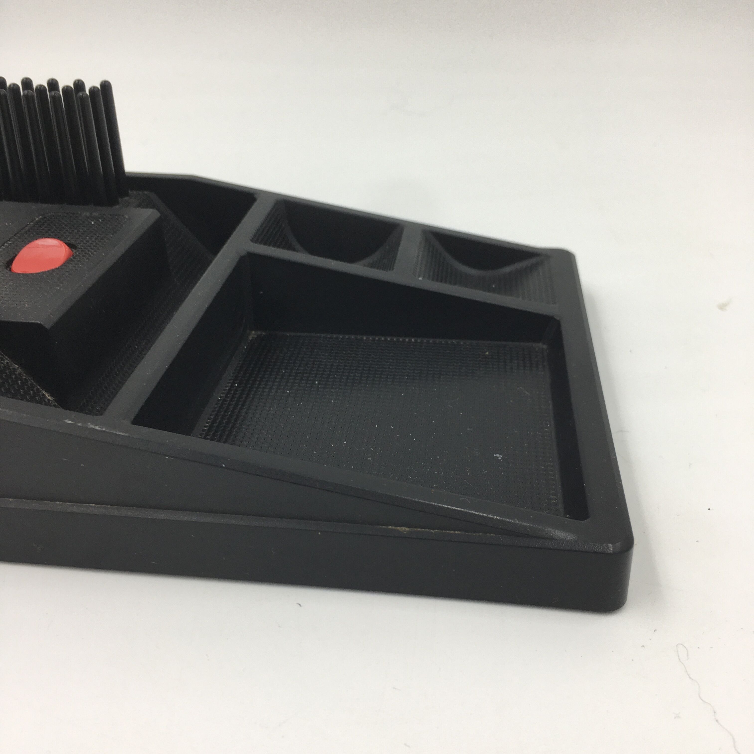 Duo of red and black flexible desk lamps with pencil holder