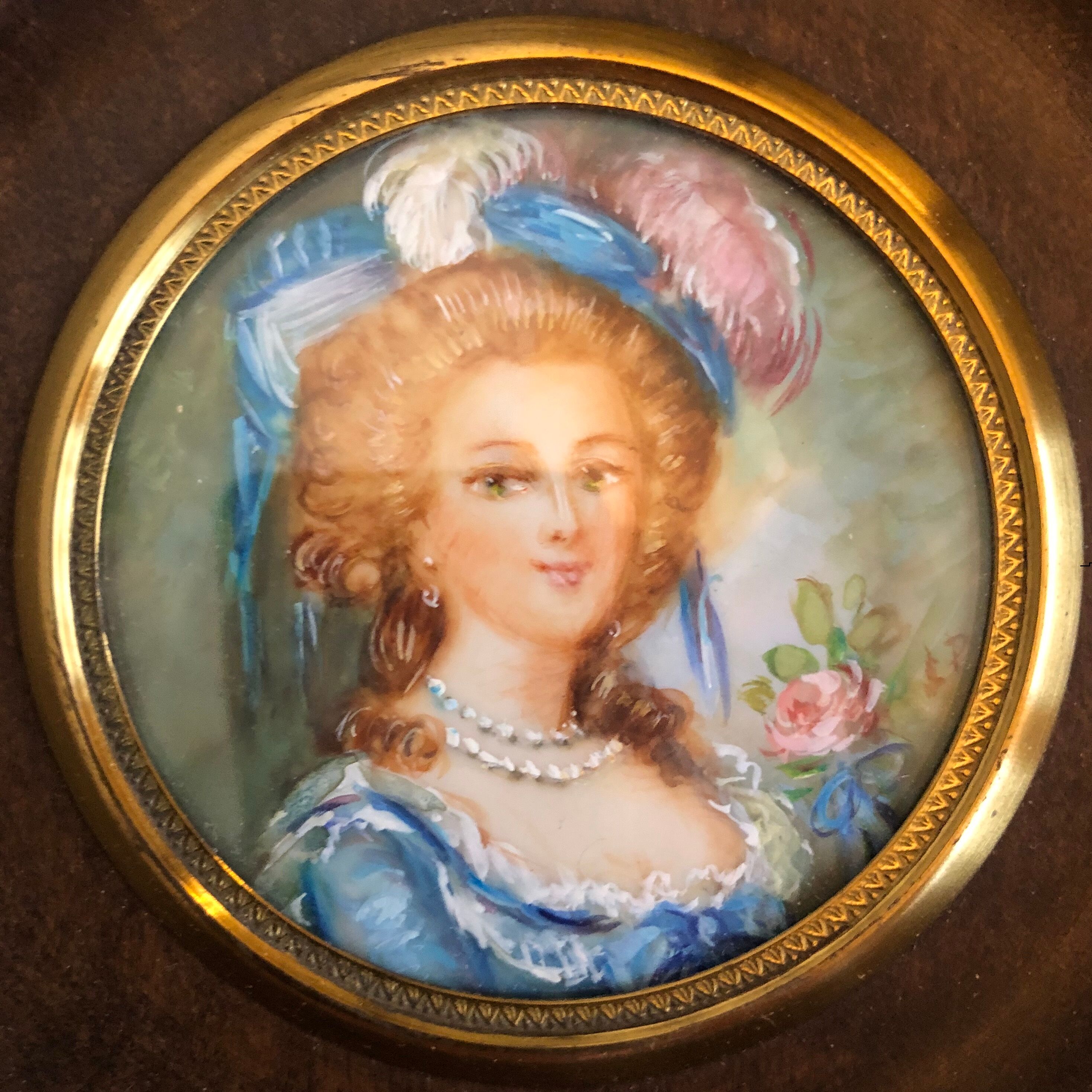 Elegant miniature in blue hat