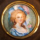 Elegant miniature in blue hat