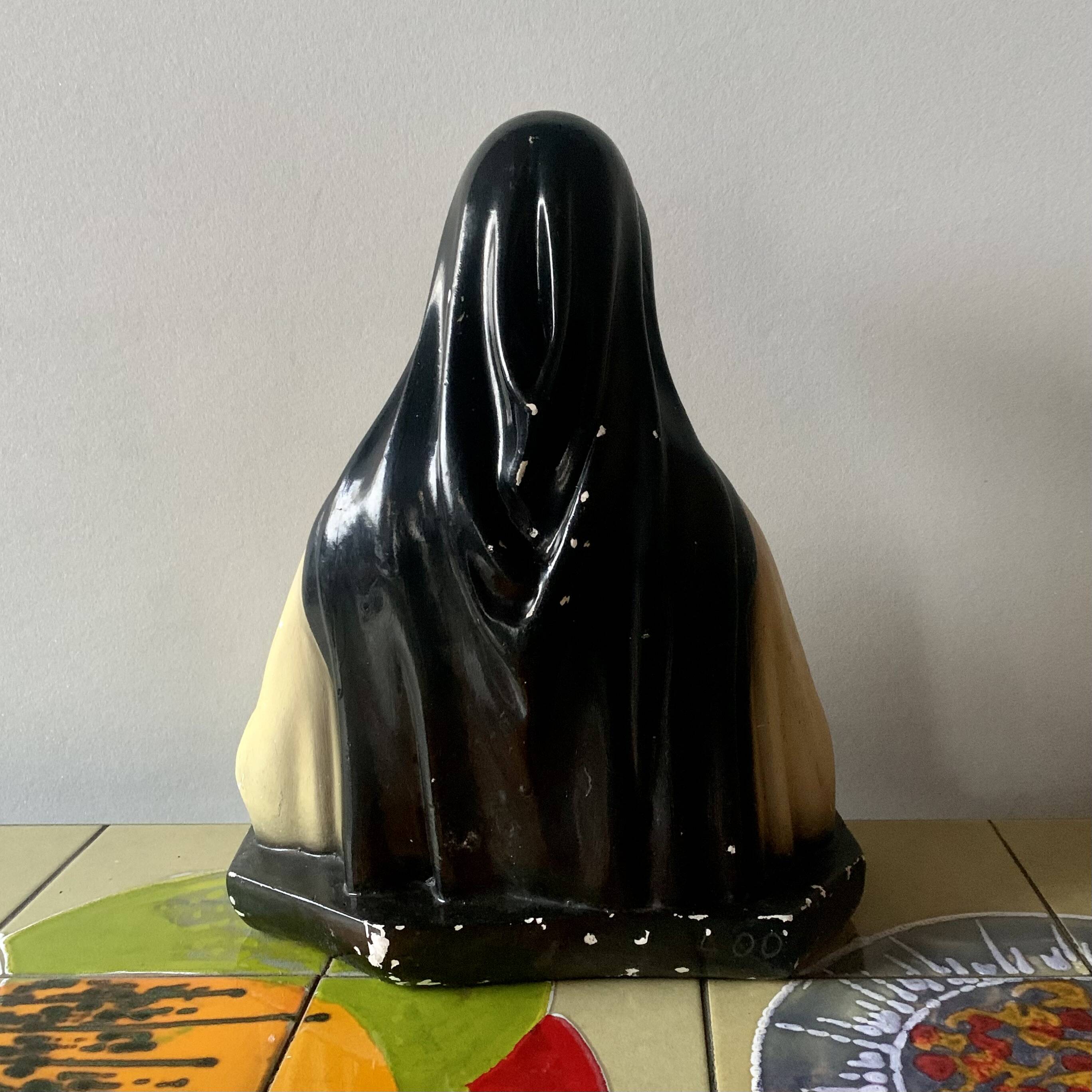 Old plaster bust of Saint Thérèse of Lisieux