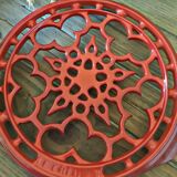 Red cast iron underside Le Creuset