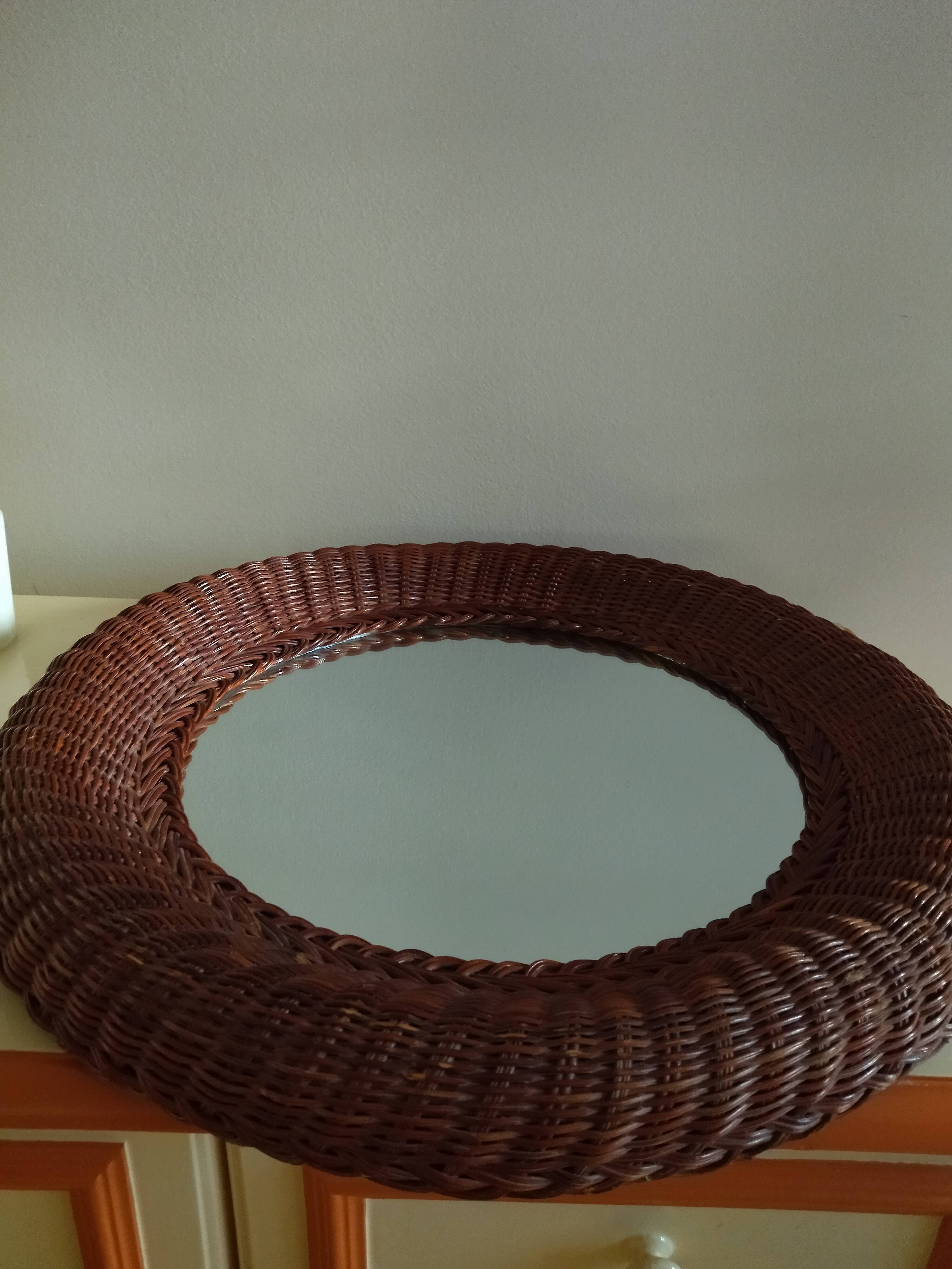 Round mirror, dark rattan