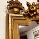 Antique English golden barock mirror mirror with large ornament