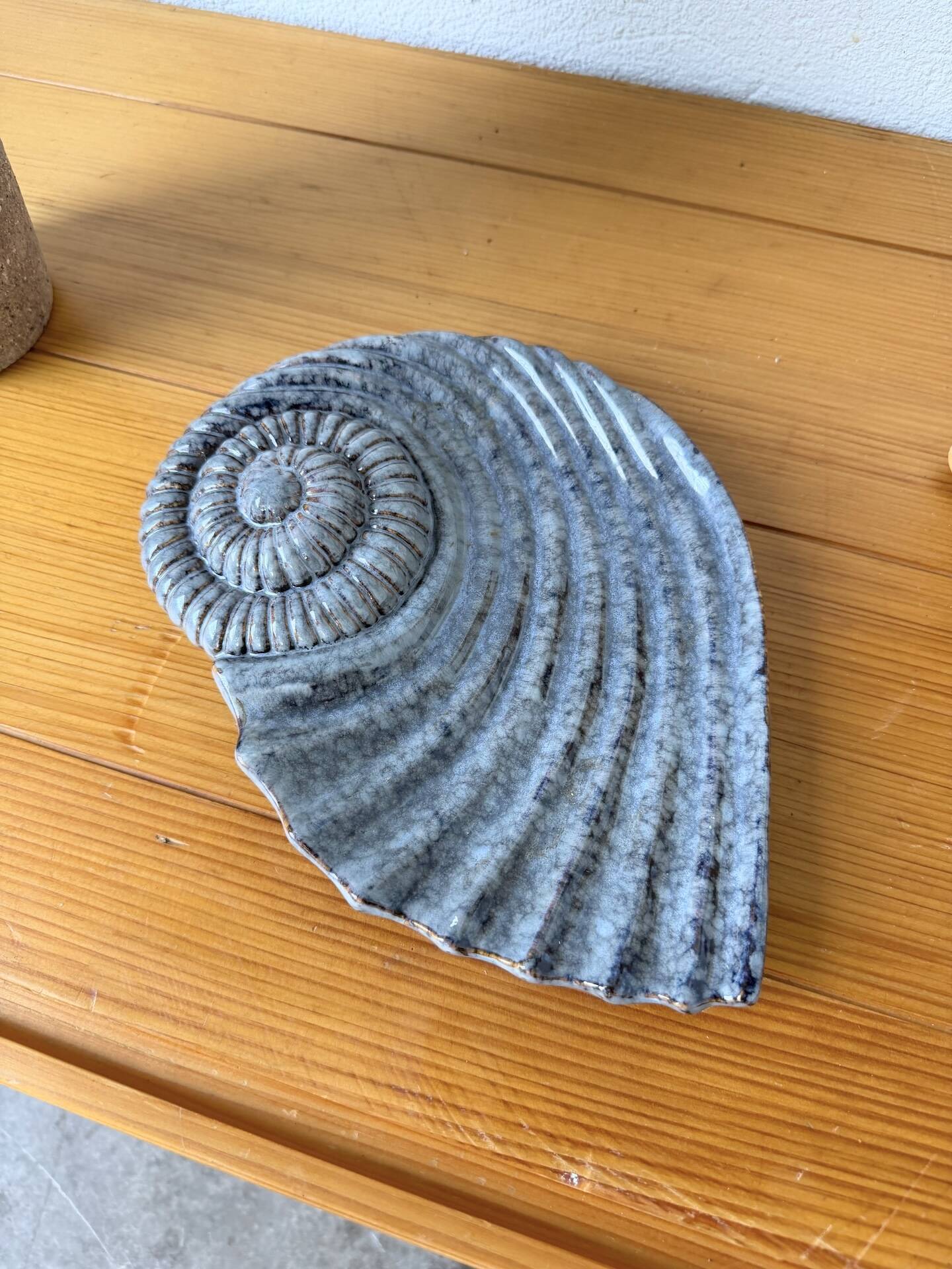 Shell-shaped ceramic catchall.