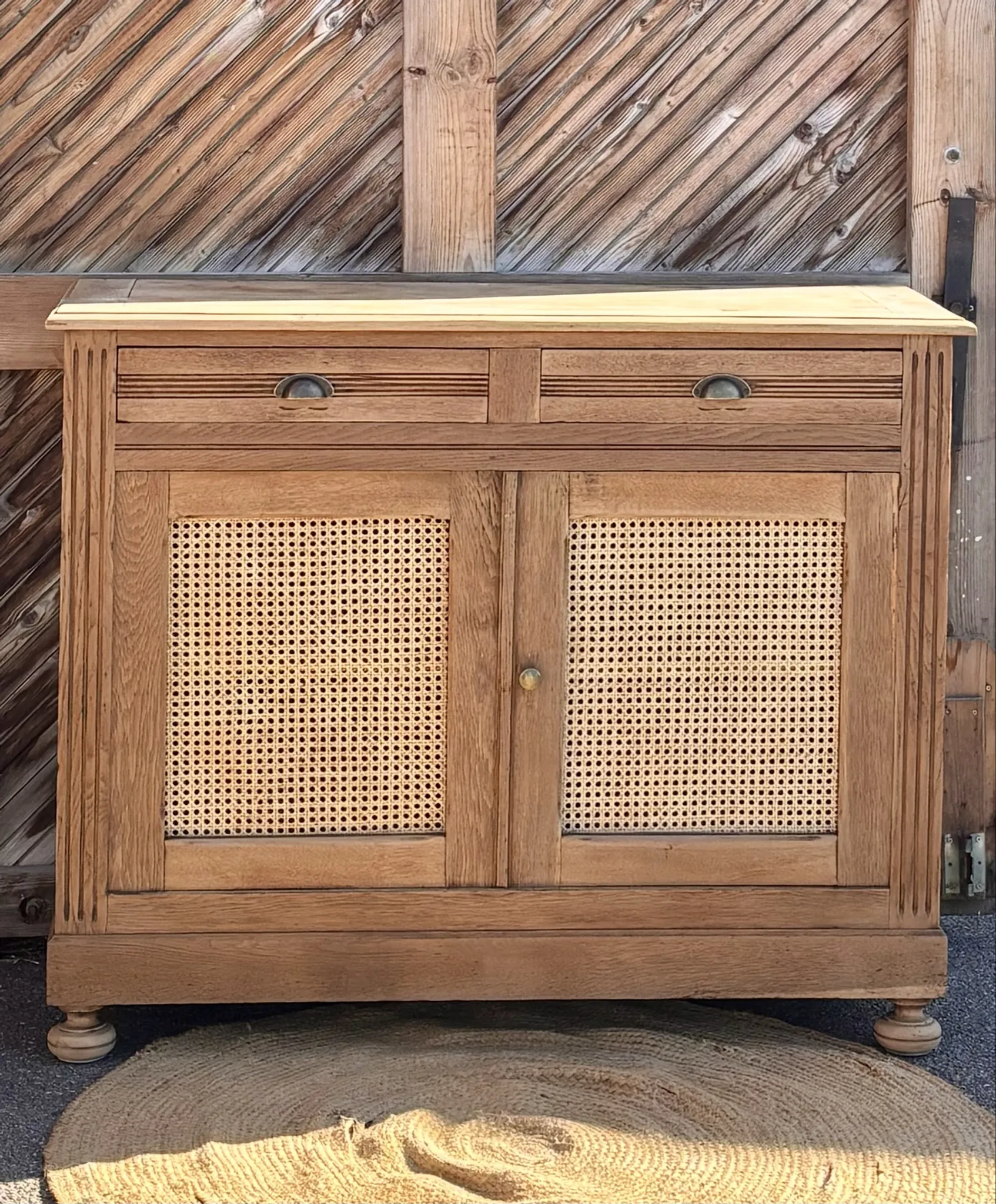 Old buffet in raw solid oak and cane.