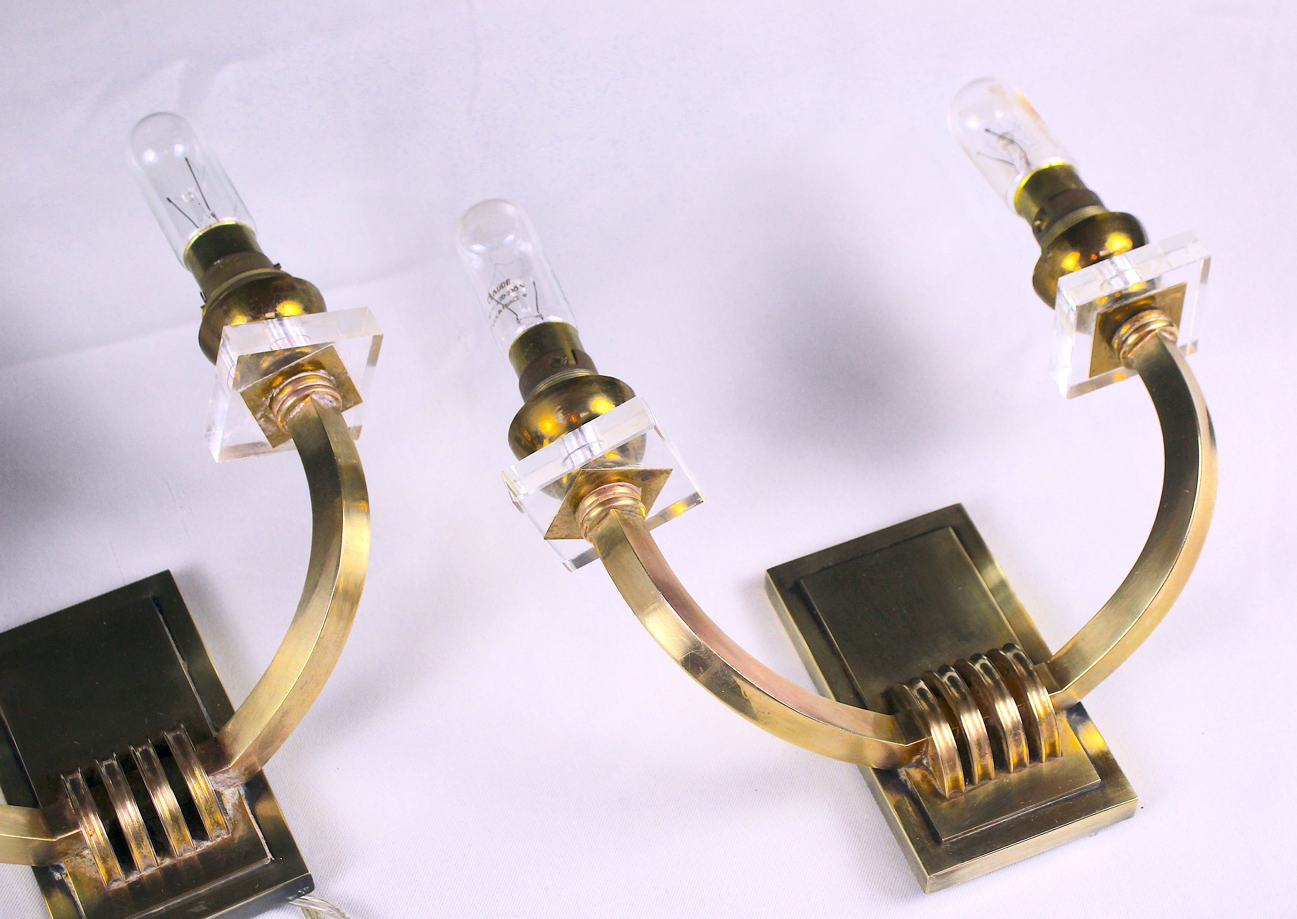 Three double wall lamps  Brass and lucite, France Mid-Century
