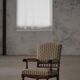Modern Danish armchair in turned wood with floral fabric, early 20th century.