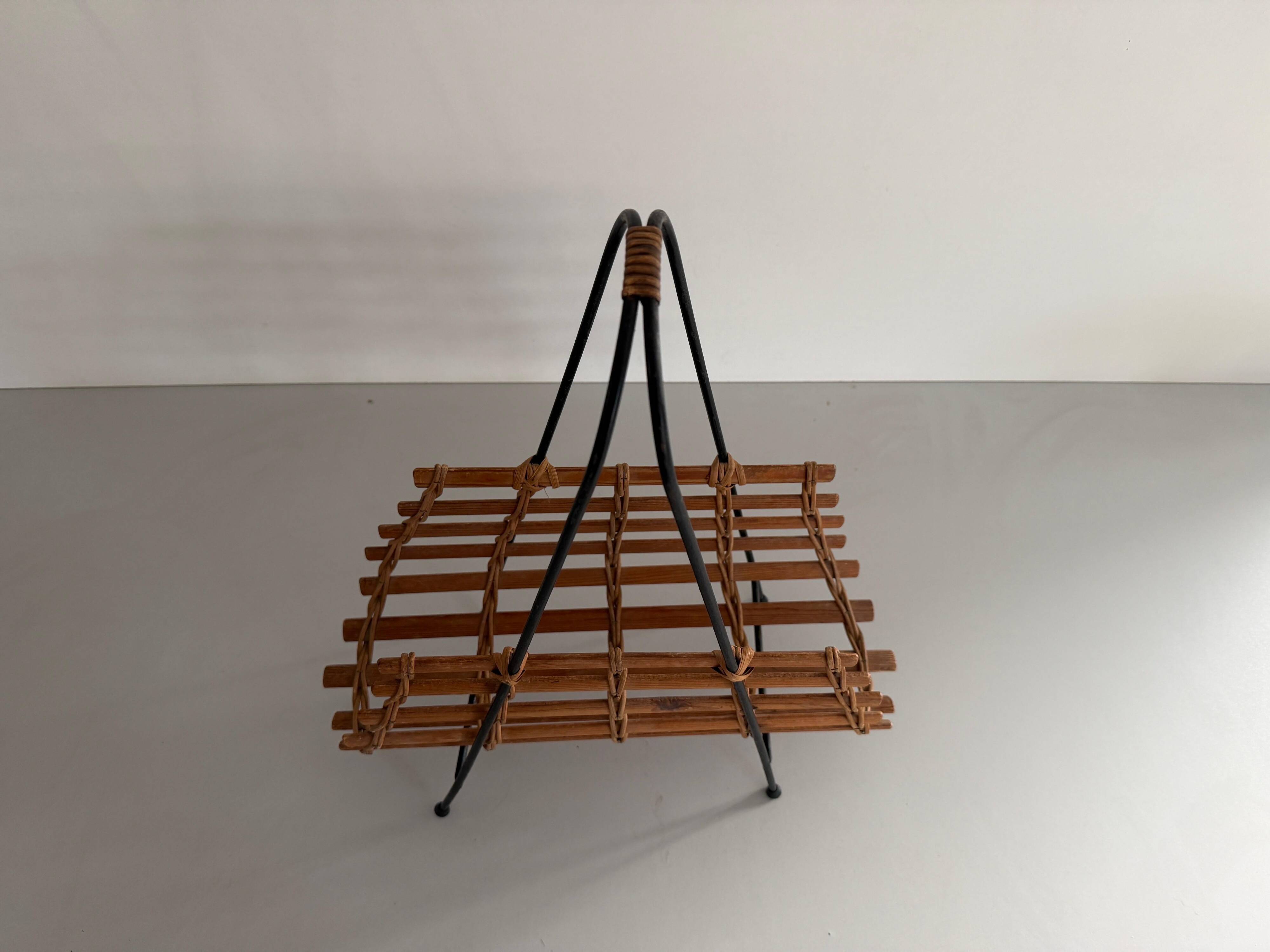 Mid-century black metal and wicker magazine rack, 1960, Germany