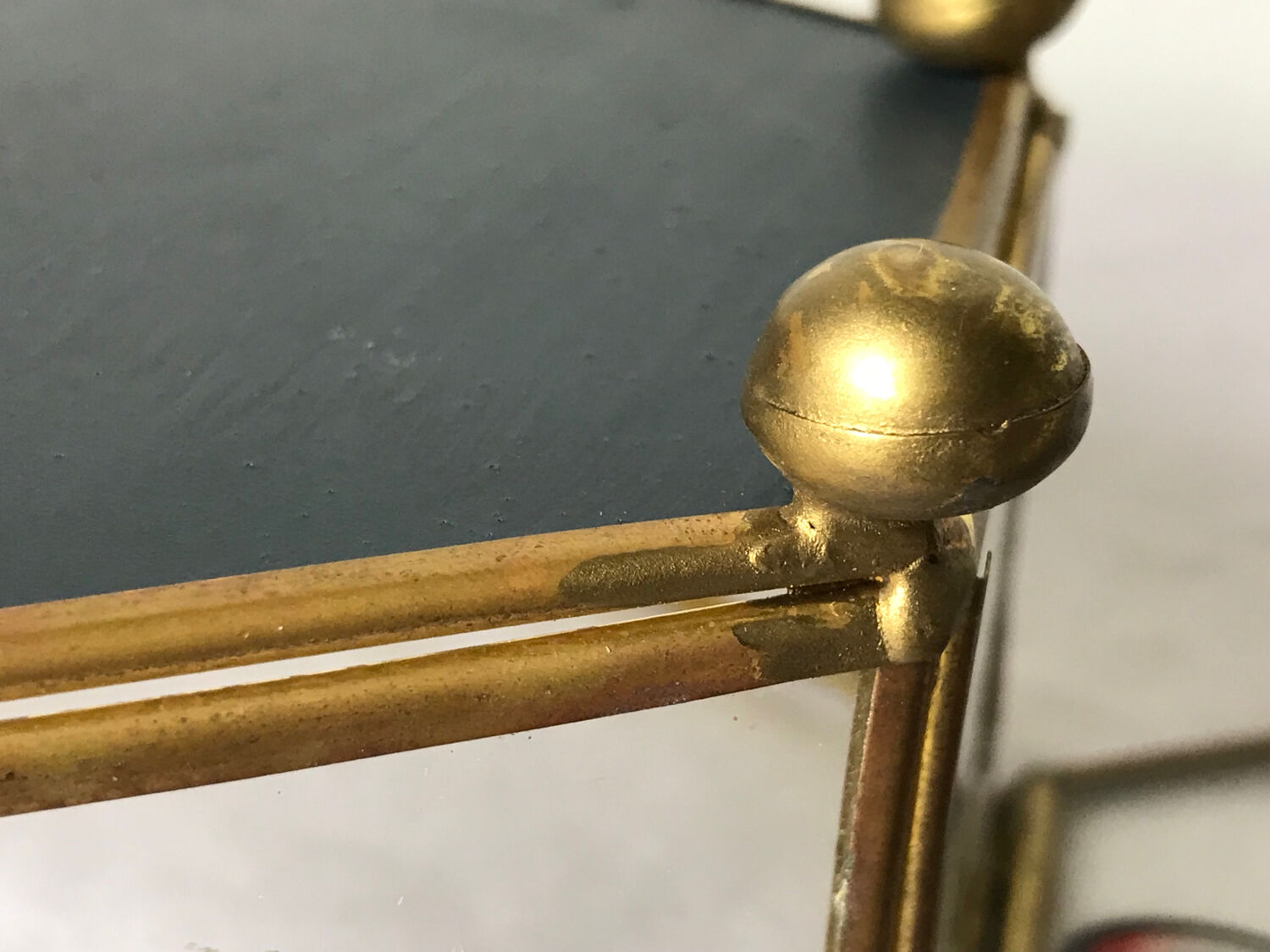 Glass box and hexagonal brass enamelled floral decoration