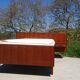 Antique teak bed with integrated bedside table